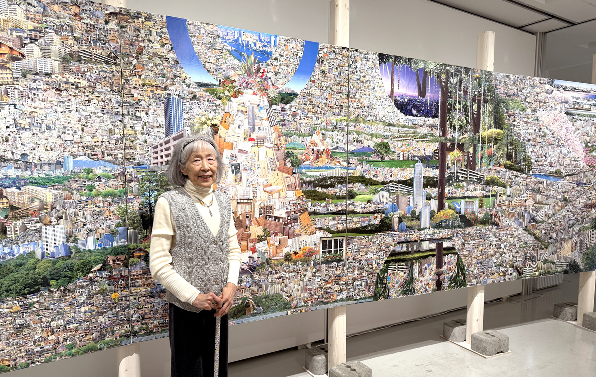 Artist SHIMA Eiko standing before her work at Art Brut 2025 Touring Exhibition Encounter with the Known, Tokyo Shibuya Koen-dori Gallery